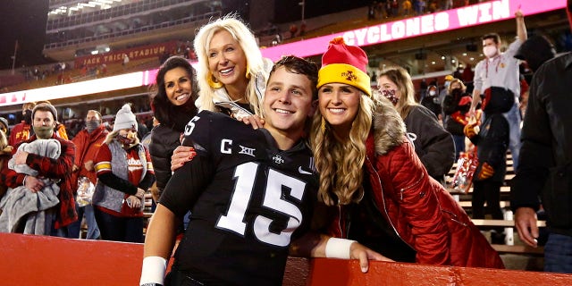 Iowa State Cyclones quarterback Brock Purdy, #15, celebrates with his mother Carrie Purdy, left, and sister Whitney Purdy after winning 37-30 over the Oklahoma Sooners at Jack Trice Stadium on Oct. 3, 2020 in Ames, Iowa.
