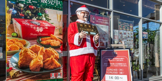 A statue of KFC's Colonel Sanders in a Santa outfit is seen in Tokyo, Japan, on Dec. 23, 2020