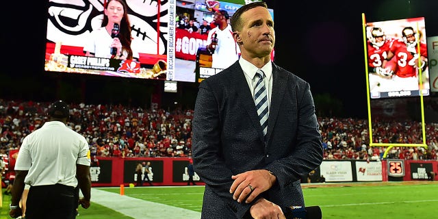 Drew Brees stands on the sidelines during a game between the Tampa Bay Buccaneers and the Dallas Cowboys at Raymond James Stadium on September 9, 2021 in Tampa, Florida. 