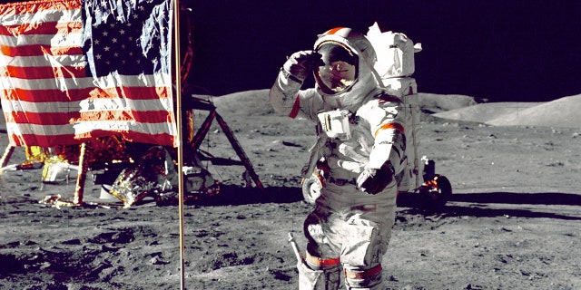 Eugene A. Cernan, commander, Apollo 17, salutes the U.S. flag on the lunar surface during extra-vehicular activity (EVA) on NASA's final lunar landing mission.