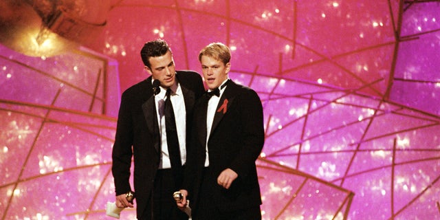 Ben Affleck and Matt Damon on stage during the 55th Annual Golden Globe Awards in 1998.