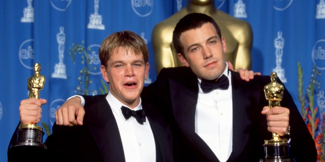 Matt Damon and Ben Affleck celebrate after winning their Oscars for "Good Will Hunting" during the 70th Annual Academy Awards on March 23, 1998.