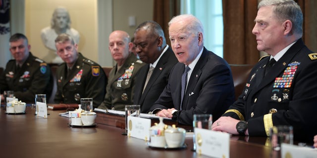 President Biden meets with Secretary of Defense Lloyd Austin, third from the right, Chairman of the Joint Chiefs of Staff Gen. Mark Milley, right, Commandant of the Marine Corps Gen. David Berger, third from the left, members of the Joint Chiefs of Staff, and combatant commanders in the Cabinet Room of the White House April 20, 2022, in Washington, D.C.