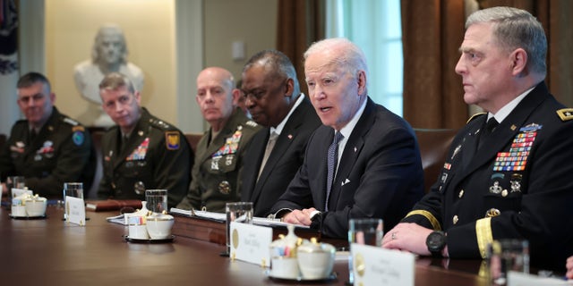 President Biden meets with Secretary of Defense Lloyd Austin, third from the right, Chairman of the Joint Chiefs of Staff Gen. Mark Milley, right, Commandant of the Marine Corps Gen. David Berger, third from the left, members of the Joint Chiefs of Staff, and combatant commanders in the Cabinet Room of the White House April 20, 2022, in Washington, D.C.