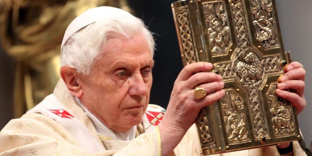 Pope Benedict XVI shows the gospel as he celebrates a mass with newly appointed cardinals at St. Peter's Basilica, on Feb. 19, 2012, in Vatican City, Vatican.