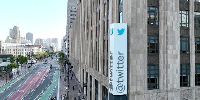 In an aerial view, a sign is seen posted on the exterior of Twitter headquarters on April 27, 2022 in San Francisco, California. 