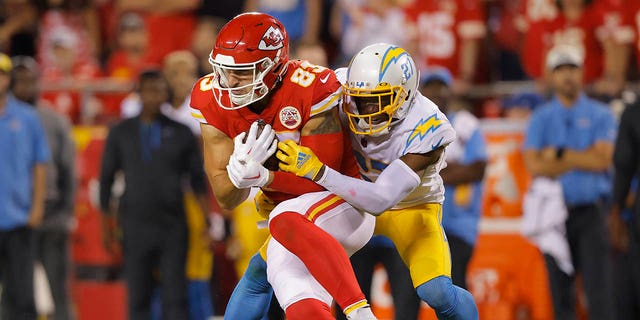 Noah Gray of the Chiefs catches the ball in front of J.C. Jackson of the Los Angeles Chargers at Arrowhead Stadium on Sept. 15, 2022, in Kansas City, Missouri.