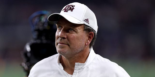 Coach Jimbo Fisher of the Texas A and M Aggies walks off the field after the Arkansas Razorbacks game on Sept. 24, 2022, in Arlington, Texas.