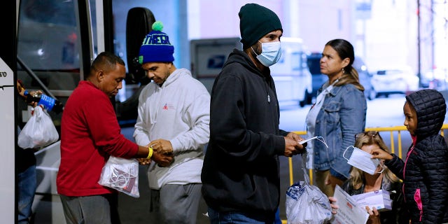 Migrants arrive to the Port Authority bus station in New York City on a bus from Texas on Oct. 7, 2022.