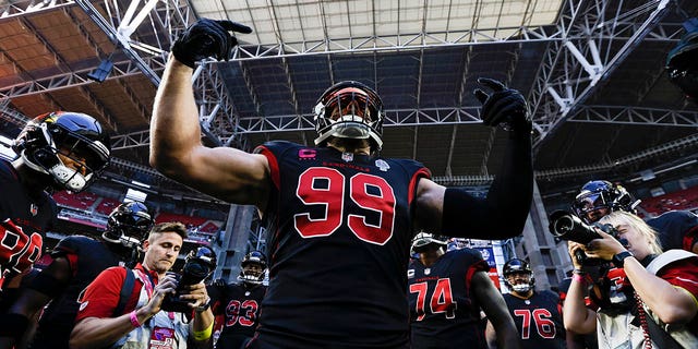 JJ Watt of the Arizona Cardinals leads the crowd before a game against the New Orleans Saints at State Farm Stadium on October 20, 2022 in Glendale, Arizona.