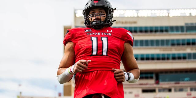 Linebacker Dimitri Moore, #11 of the Texas Tech Red Raiders, warms up before the game against the West Virginia Mountaineers at Jones AT&amp;T Stadium on Oct. 22, 2022 in Lubbock, Texas.