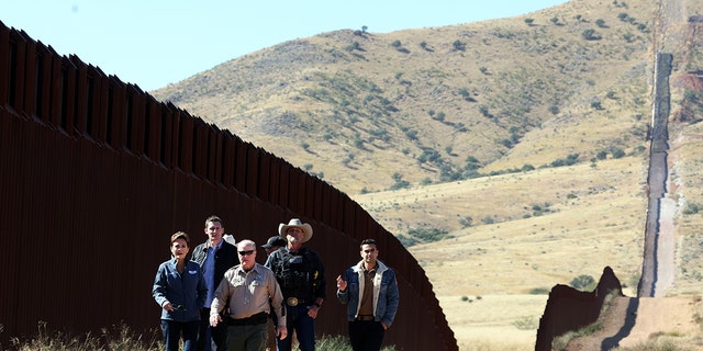 Arizona Republican Gubernatorial candidate Kari Lake, left, Republican Senate candidate Blake Masters, 2nd from left, and Arizona Attorney General candidate Abe Hamadeh, right, at the U.S.-Mexico border on November 04, 2022 in Sierra Vista, Arizona. 