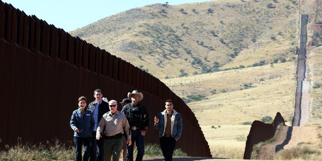 Arizona Republican Gubernatorial candidate Kari Lake, left, Republican Senate candidate Blake Masters, 2nd from left, and Arizona Attorney General candidate Abe Hamadeh, right, at the U.S.-Mexico border on November 04, 2022 in Sierra Vista, Arizona. 