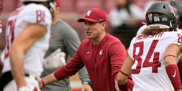 Head coach Jake Dickert of the Washington State Cougars looks on while his team warms up prior to playing the Stanford Cardinal at Stanford Stadium Nov. 5, 2022 in Stanford, Calif.