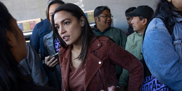 Congresswoman Alexandria Ocasio-Cortez campaigns for re-election on November 8, 2022 in the Woodside neighborhood of Queens, New York on election morning. 