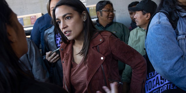 On election morning Congresswoman Alexandria Ocasio-Cortez campaigns for re-election, November 8, 2022 in the Woodside neighborhood of Queens, New York. 