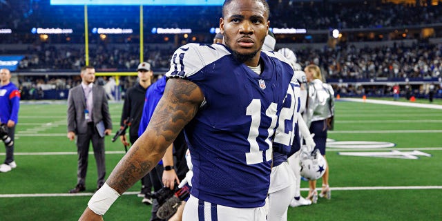 Micah Parsons, number 11 of the Dallas Cowboys, walks off the field after a game against the New York Giants at AT&T Stadium on November 24, 2022 in Arlington, Texas.  The Cowboys defeated the Giants 28-20. 