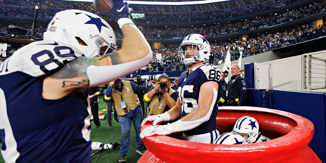 Peyton Hendershot #89 of the Dallas Cowboys celebrates with teammates after scoring a touchdown against the New York Giants on Nov. 24, 2022, in Arlington, Texas. The Cowboys defeated the Giants, 28-20.