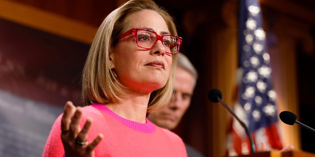 Sen. Kyrtsen Sinema speaks at a news conference at the Capitol on Nov. 29, 2022.