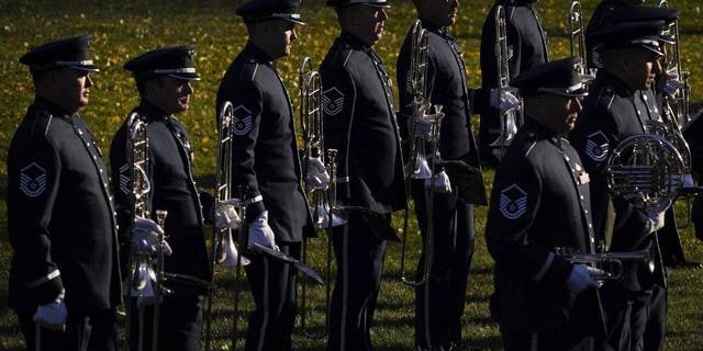Members of the U.S. Air Force Band await the start of a state visit arrival ceremony for French President Emmanuel Macron at the White House on Dec. 1, 2022.