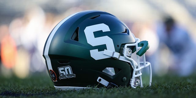 A Michigan State Spartans helmet on the field before a game against the Penn State Nittany Lions at Beaver Stadium on November 26, 2022 in State College, Pennsylvania. 