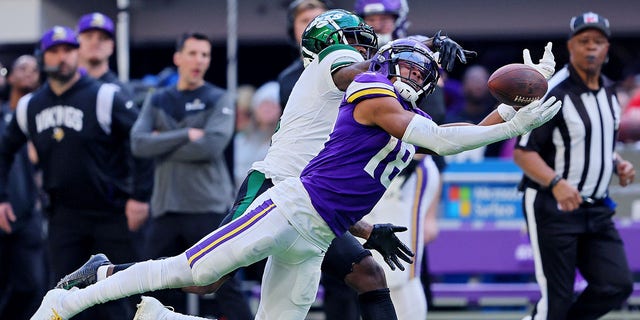 Justin Jefferson, #18 of the Minnesota Vikings, fails to catch a pass while defended by D.J. Reed, #4 of the New York Jets, during the second quarter at U.S. Bank Stadium on Dec. 4, 2022 in Minneapolis.