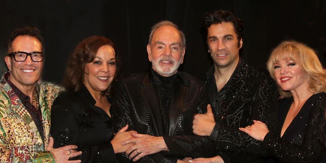 Neil Diamond pictured backstage with director Michael Mayer; Will Swenson, who plays Diamond; Robyn Hurder, who portrays Diamond's second wife Marcia Murphey; and Linda Powell, who plays the doctor.