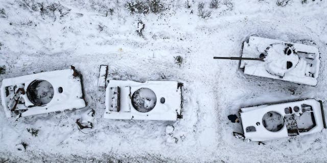   Man destroyed Russian tanks outside Bucha on December 5, 2022 in Bucha, Ukraine.  Ukrainian officials expect a new wave of Russian shelling this week, with previous rounds targeting critical infrastructure and causing massive water and power outages, including in the capital Kiev.