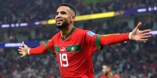 Youssef En-Nesyri of Morocco celebrates after scoring the team's first goal during the FIFA World Cup Qatar 2022 quarter final match between Morocco and Portugal at Al Thumama Stadium on December 10, 2022 in Doha, Qatar. 