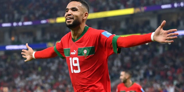 Youssef En-Nesyri of Morocco celebrates after scoring the team's first goal during the FIFA World Cup Qatar 2022 quarter final match between Morocco and Portugal at Al Thumama Stadium on December 10, 2022 in Doha, Qatar.