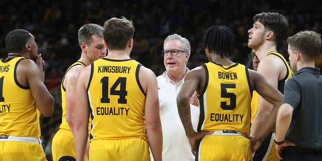 Iowa Hawkeyes head coach Fran McCaffery talks to players during a timeout in the first half against the Wisconsin Badgers at Carver-Hawkeye Arena, on Dec. 11, 2022 in Iowa City, Iowa.  