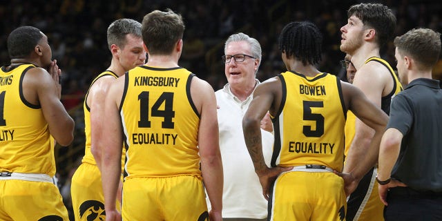 Iowa Hawkeyes head coach Fran McCaffery talks to players during a timeout in the first half against the Wisconsin Badgers at Carver-Hawkeye Arena, on Dec. 11, 2022 in Iowa City, Iowa.  