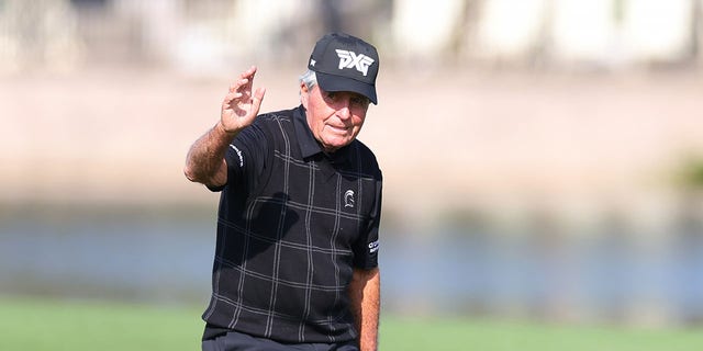 Gary Player waves to the crowd on the 18th hole during the pro-am prior to the PNC Championship at Ritz-Carlton Golf Club on Dec. 16, 2022 in Orlando, Florida.