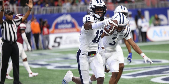 JSU receiver Travis Hunter celebrates with teammates after scoring during the Jackson State Tigers and North Carolina Central Eagles Celebration Bowl football championship game at Mercedes-Benz Stadium on December 17, 2022 in Atlanta , GA 