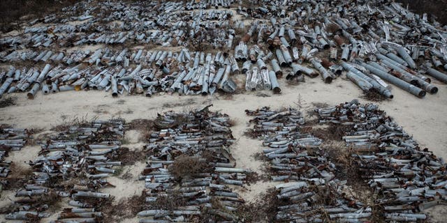 More than a thousand missiles and rockets fired by Russian forces and collected by prosecutors for use in war crimes investigations are seen at a depot on Dec. 18, 2022, in Kharkiv, Ukraine.