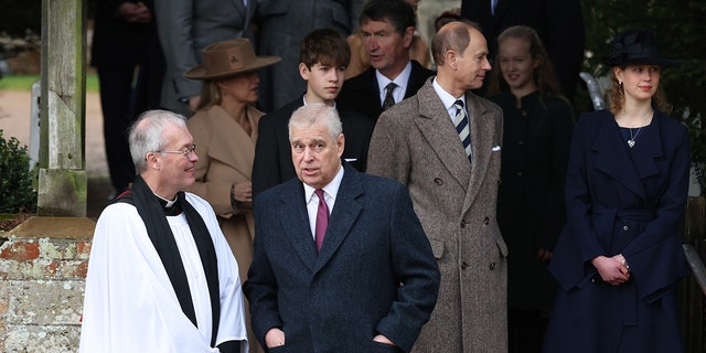 Prince Andrew spoke with the reverend outside church services.