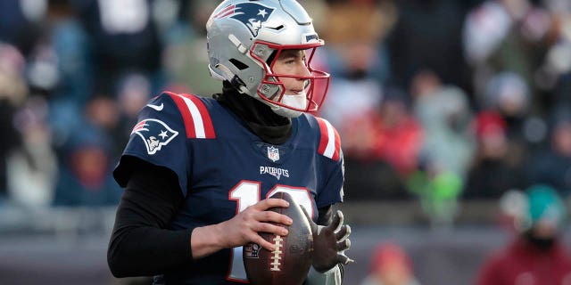 New England Patriots number 10 Mac Jones looks down during the second half against the Cincinnati Bengals at Gillette Stadium on December 24, 2022 in Foxborough, Massachusetts.