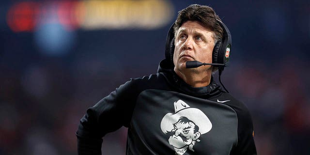 Oklahoma State Cowboys head coach Mike Gundy looks on during the first half of the Guaranteed Rate Bowl against the Wisconsin Badgers at Chase Field on December 27, 2022 in Phoenix.