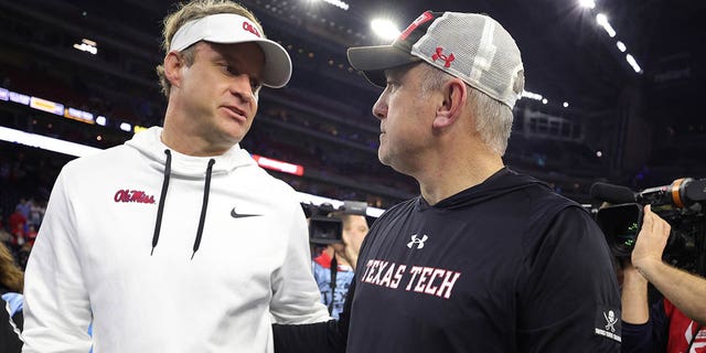 Texas Tech Red Raiders head coach Joey McGuire and Mississippi Rebels head coach Lane Kiffin shake hands at NRG Stadium on December 28, 2022 in Houston.