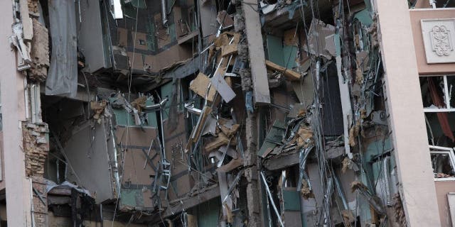 Part of a hotel sits destroyed following a missile attack on New Year’s Eve, Dec. 31, 2022 in Kyiv, Ukraine. Kyiv Mayor Vitali Klitschko said in a statement that at least one person had been killed.