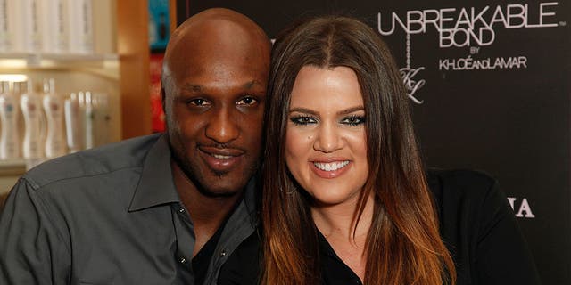 Professional basketball player Lamar Odom and TV personality Khloe Kardashian make an appearance to promote their fragrance, Unbreakable Bond, at Perfumania June 7, 2012, in Orange, Calif.  