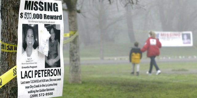 A missing person's poster offering a $500,000 reward for the safe return of Laci Peterson is displayed on a tree at the East La Loma Park Jan. 4, 2003, in Modesto, Calif.
