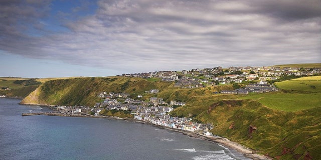 The quaint village of Gardenstown seen from the ruins of St Johns Chapel, Banffshire, Northeast Scotland, Scotland, United Kingdom.