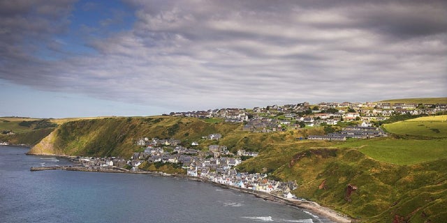 The quaint village of Gardenstown seen from the ruins of St Johns Chapel, Banffshire, Northeast Scotland, Scotland, United Kingdom.