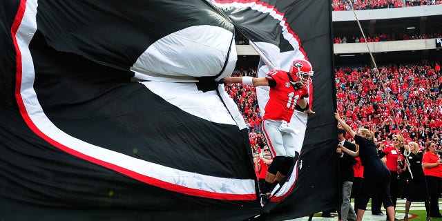 Aaron Murray #11 of the Georgia Bulldogs takes to the field before the game against the Appalachian State Mountaineers at Sanford Stadium on November 9, 2013, in Athens, Georgia.