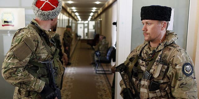 Pro-Russian rebels are shown wearing papakha.