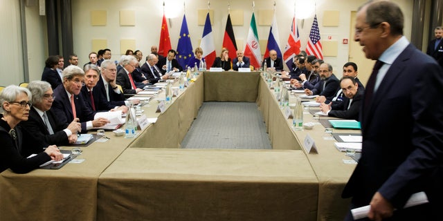 Russian Foreign Minister Sergey Lavrov, right, arrives for a meeting with P5+1, European Union and Iranian officials during nuclear talks with Iran at the Beau Rivage Palace Hotel in Lausanne, Switzerland, on March 30, 2015.