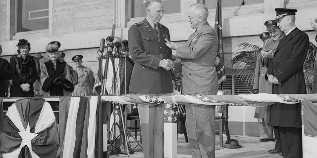 In ceremonies held in the Pentagon Court, President Harry Truman (center, at right) awards an Oak Leaf Cluster to the Distinguished Service Cross to General George C. Marshall, retiring chief of staff.