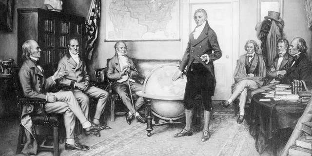 Illustration depicting the birth of the Monroe Doctrine. James Monroe, the nation's 5th president, is shown standing beside a globe; John Quincy Adams is seated at left. From a painting by Clyde O. DeLand.