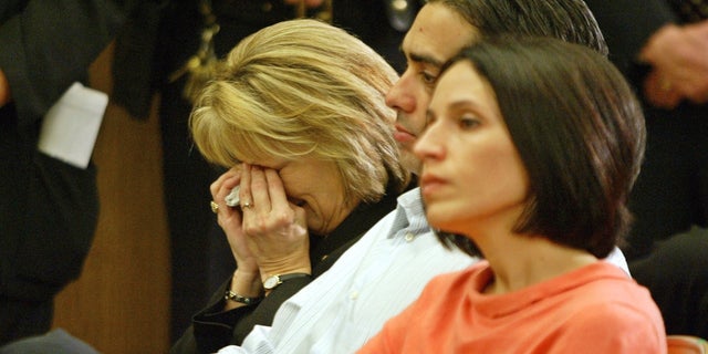 (L-R) Sharon Rocha, Brent Rocha and his wife, Rose Marie Rocha, sit during a news conference after the jury verdict sentence recommendation of death for Scott Peterson Dec. 13, 2004, in Redwood City, Calif. 